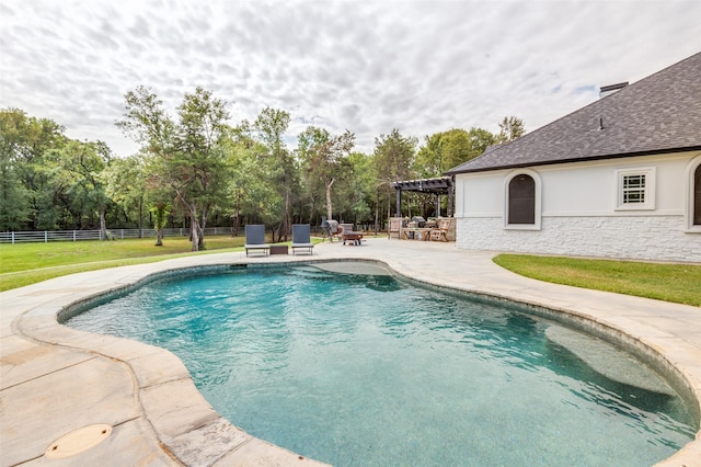 view of swimming pool featuring a patio area