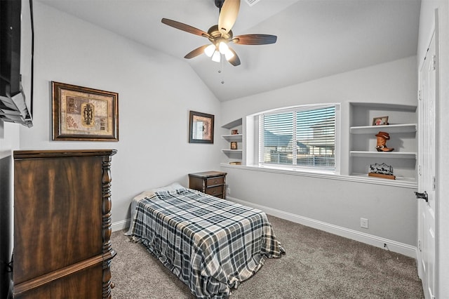 bedroom with vaulted ceiling, carpet flooring, and ceiling fan