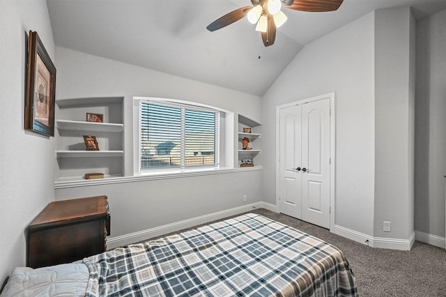 bedroom featuring ceiling fan, lofted ceiling, dark carpet, and a closet