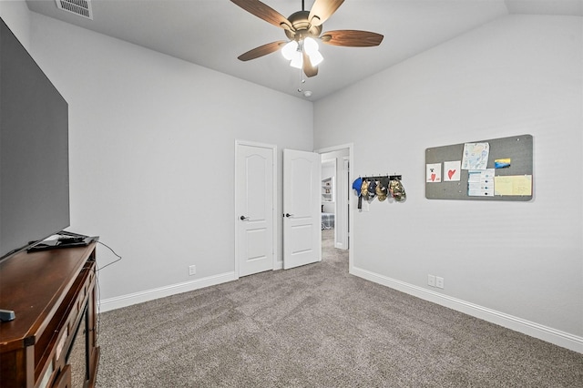 interior space with lofted ceiling and ceiling fan