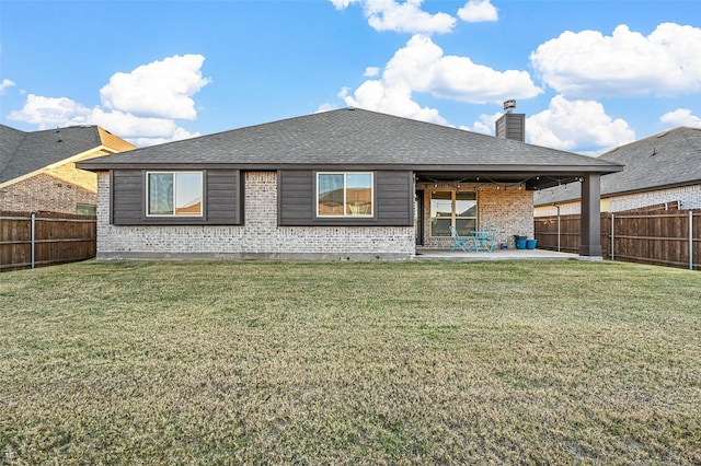 back of property featuring a patio and a lawn