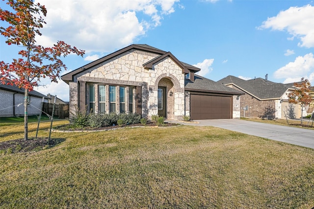 view of front of house with a garage and a front yard