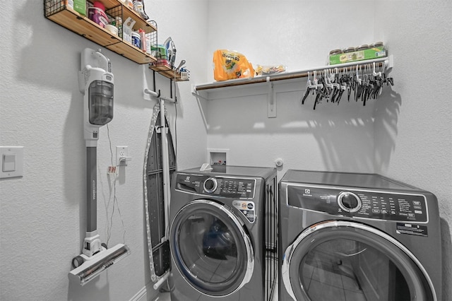 washroom featuring washing machine and dryer