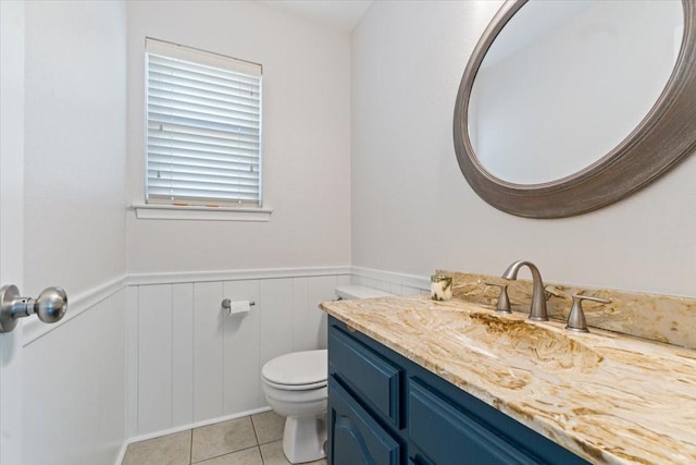 bathroom with tile patterned floors, vanity, and toilet