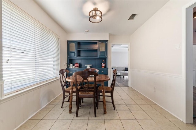 dining space with light tile patterned floors