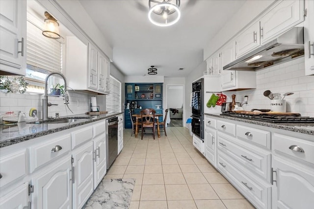 kitchen featuring white cabinets, decorative backsplash, sink, and stainless steel appliances