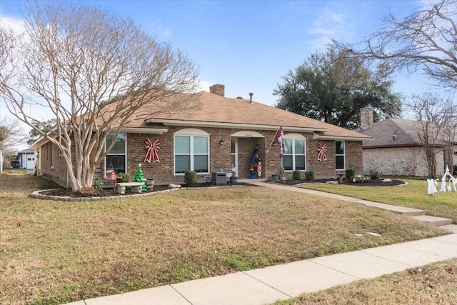 ranch-style home featuring a front yard