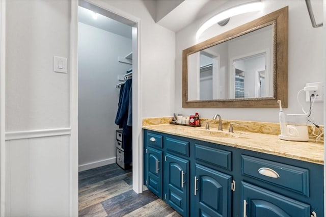 bathroom with hardwood / wood-style floors and vanity