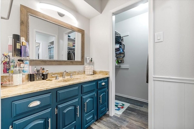 bathroom featuring vanity and hardwood / wood-style flooring