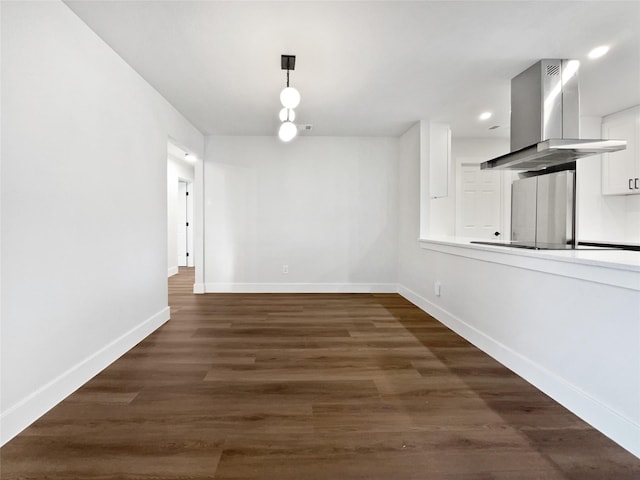 unfurnished dining area featuring dark hardwood / wood-style floors