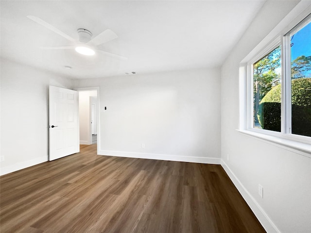 empty room with wood-type flooring and ceiling fan