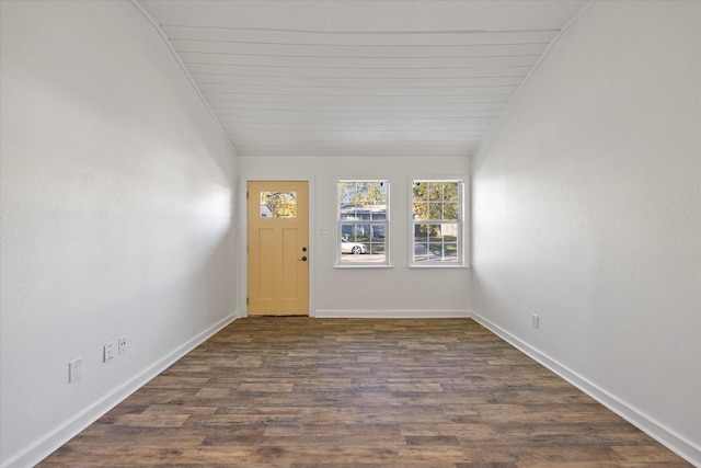 entrance foyer featuring dark hardwood / wood-style floors, lofted ceiling, and wood ceiling