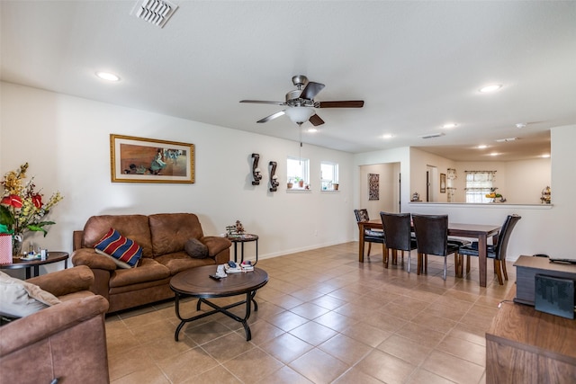 kitchen featuring sink, decorative backsplash, ceiling fan, appliances with stainless steel finishes, and light tile patterned flooring