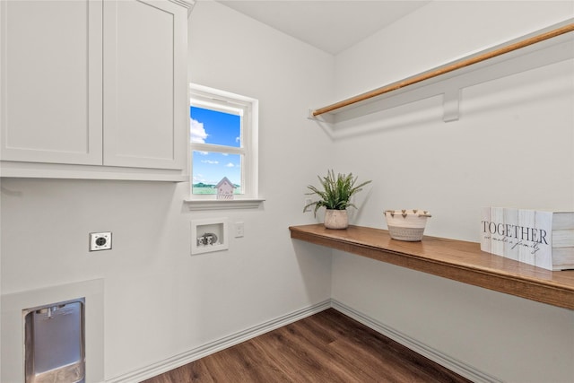 laundry area with washer hookup, electric dryer hookup, dark hardwood / wood-style flooring, and cabinets