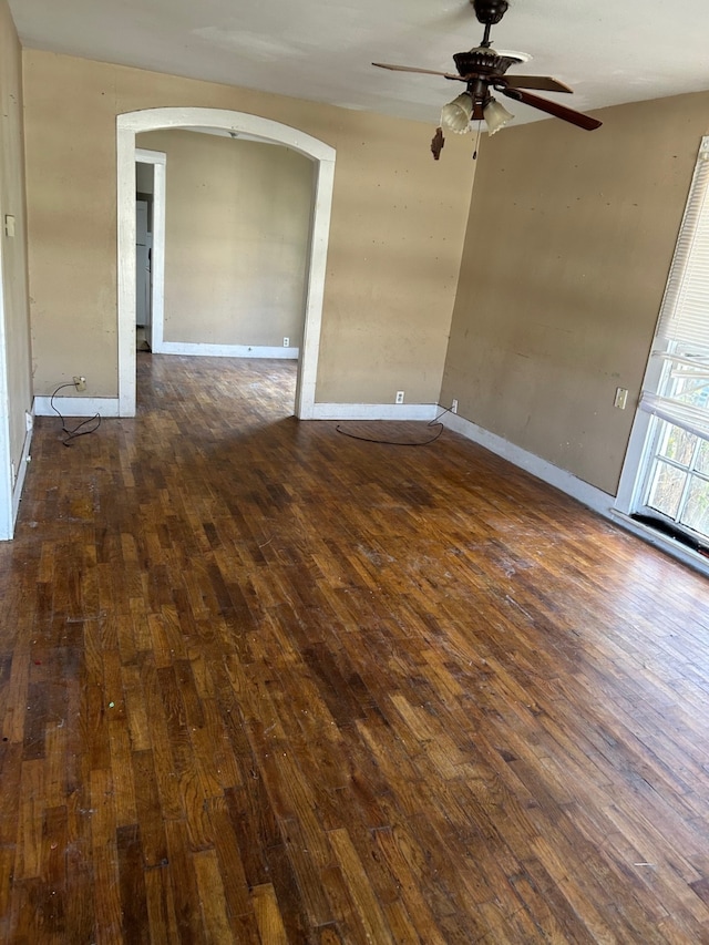 spare room featuring ceiling fan and dark hardwood / wood-style flooring