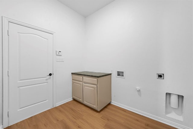 washroom with cabinets, hookup for a gas dryer, light hardwood / wood-style floors, washer hookup, and hookup for an electric dryer