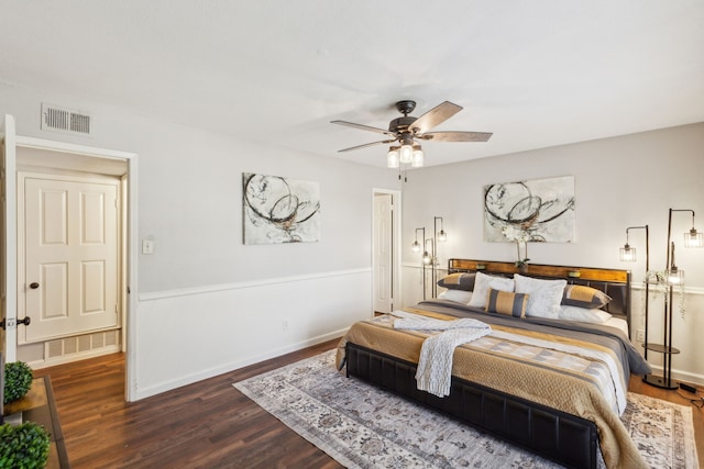 bedroom featuring ceiling fan and dark wood-type flooring