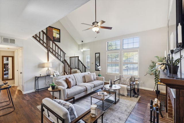 living room featuring ceiling fan, dark wood-type flooring, and high vaulted ceiling