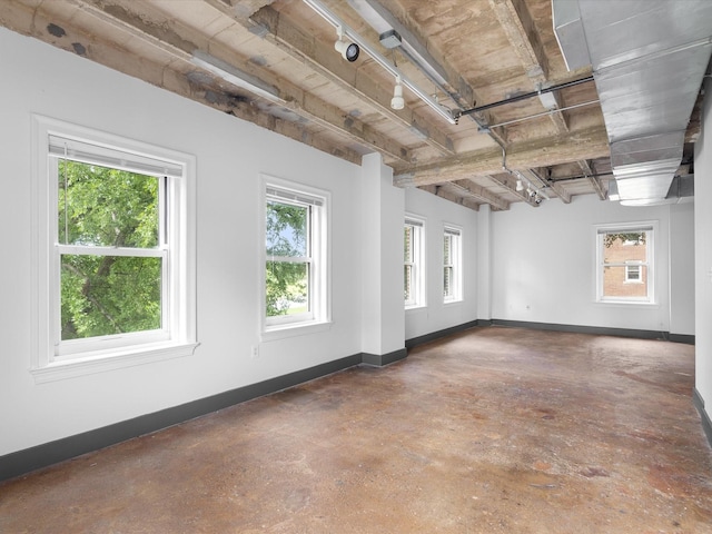329 E Colorado Blvd Unit 202, Dallas, TX 75203 - empty room with baseboards and concrete flooring