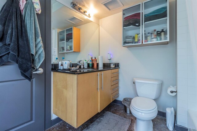 bathroom with vanity and toilet