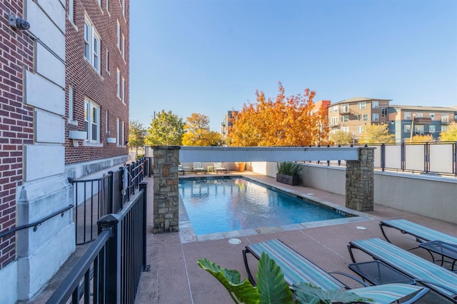 view of swimming pool with a patio area