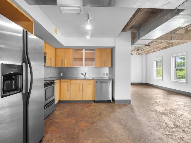 329 E Colorado Blvd Unit 202, Dallas, TX 75203 - kitchen with open shelves, dark countertops, stainless steel appliances, visible vents, and baseboards