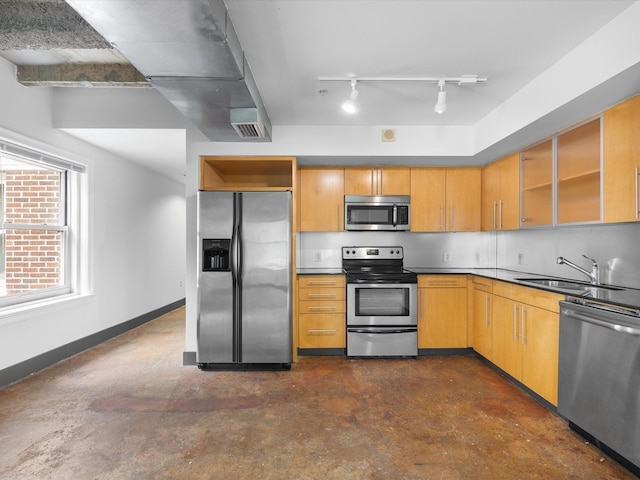 329 E Colorado Blvd Unit 202, Dallas, TX 75203 - kitchen with a sink, open shelves, concrete floors, track lighting, and appliances with stainless steel finishes