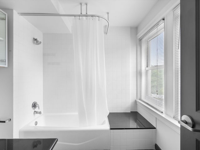 329 E Colorado Blvd Unit 202, Dallas, TX 75203 - full bathroom with shower / bath combo and tile patterned flooring