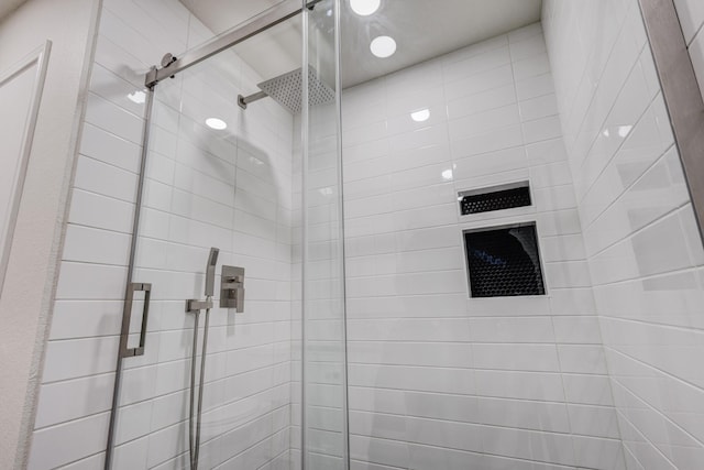 bathroom featuring an enclosed shower