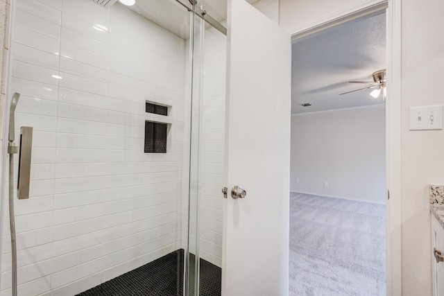 bathroom with ceiling fan, an enclosed shower, crown molding, and vanity