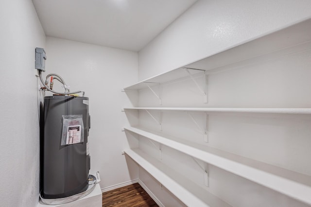 utility room featuring electric water heater