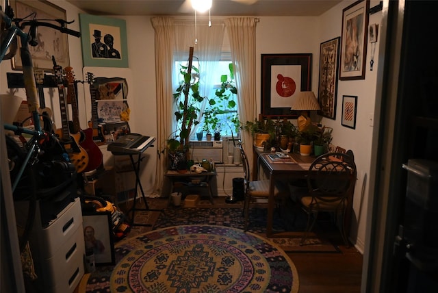 dining room featuring ceiling fan and dark wood-type flooring