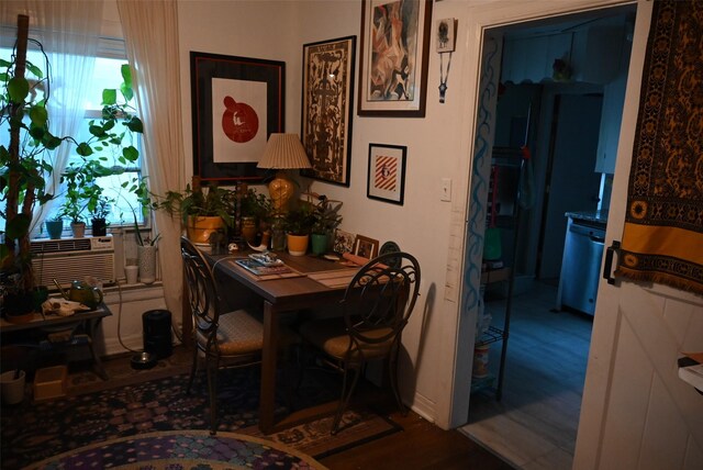 dining space featuring a wealth of natural light and hardwood / wood-style flooring