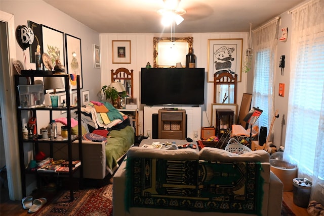 living room with ceiling fan and a healthy amount of sunlight