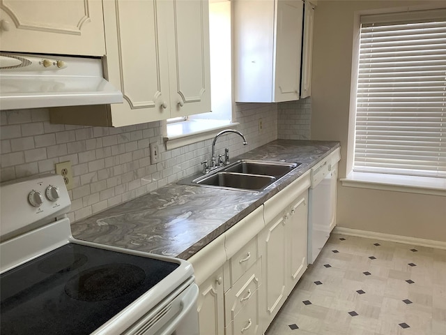 kitchen with tasteful backsplash, white cabinetry, sink, and white appliances