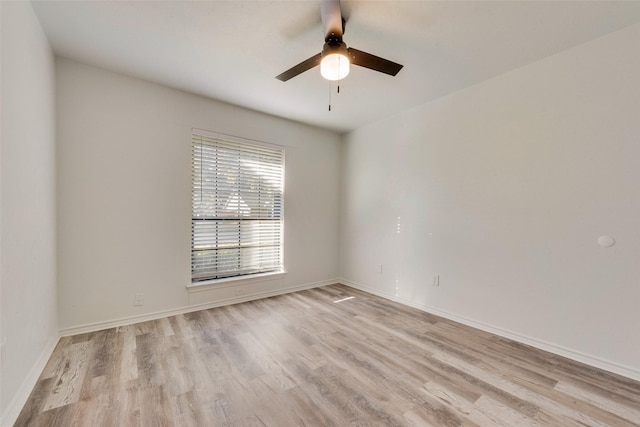 empty room with light hardwood / wood-style floors and ceiling fan