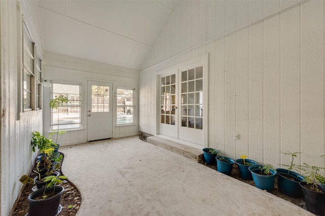 unfurnished sunroom with vaulted ceiling