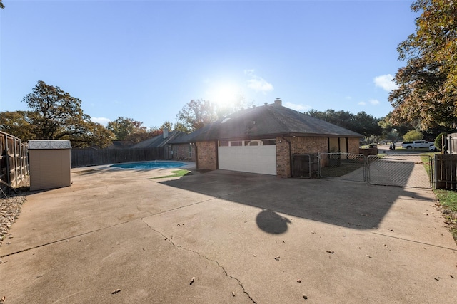 view of property exterior with a storage unit