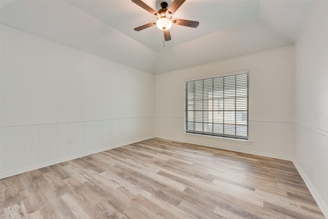 unfurnished room featuring ceiling fan, light hardwood / wood-style floors, and lofted ceiling