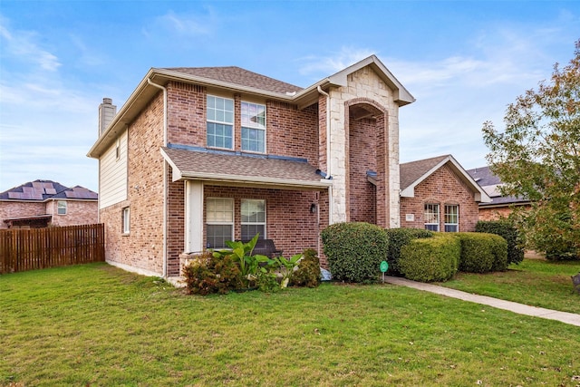 front facade featuring a front yard