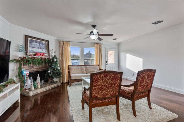 dining area with crown molding, dark wood-type flooring, and ceiling fan