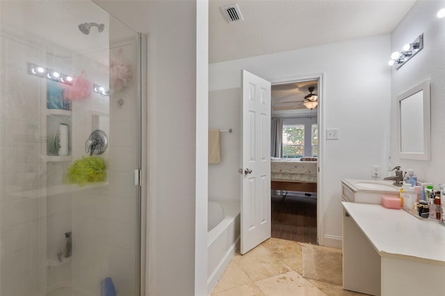 bathroom featuring vanity, tile patterned floors, shower with separate bathtub, and ceiling fan