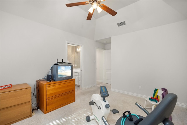 workout area featuring light carpet, ceiling fan, and lofted ceiling