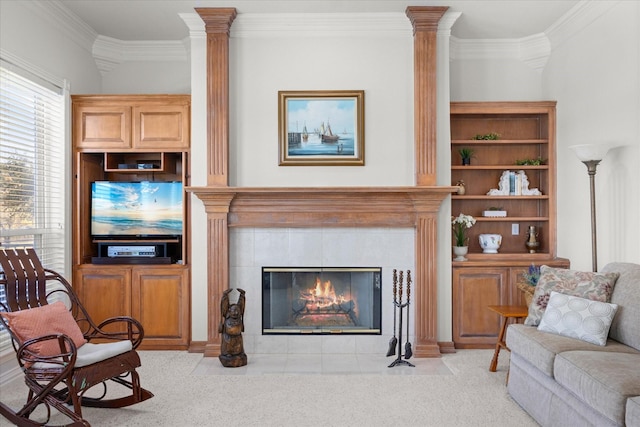 living room featuring a tile fireplace, light colored carpet, and ornamental molding