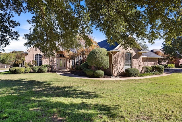 obstructed view of property featuring a front yard