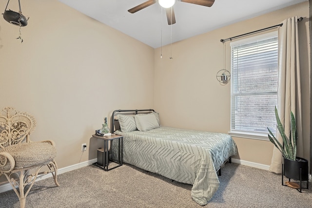 carpeted bedroom with ceiling fan and multiple windows