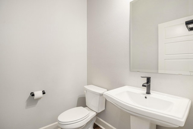 bathroom with toilet and sink