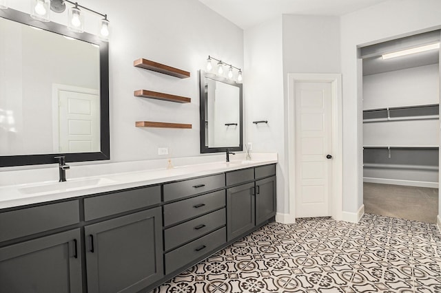 bathroom with vanity and tile patterned floors