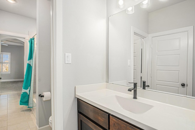 bathroom featuring tile patterned floors, toilet, and vanity