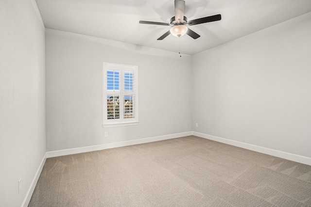 empty room with carpet flooring and ceiling fan